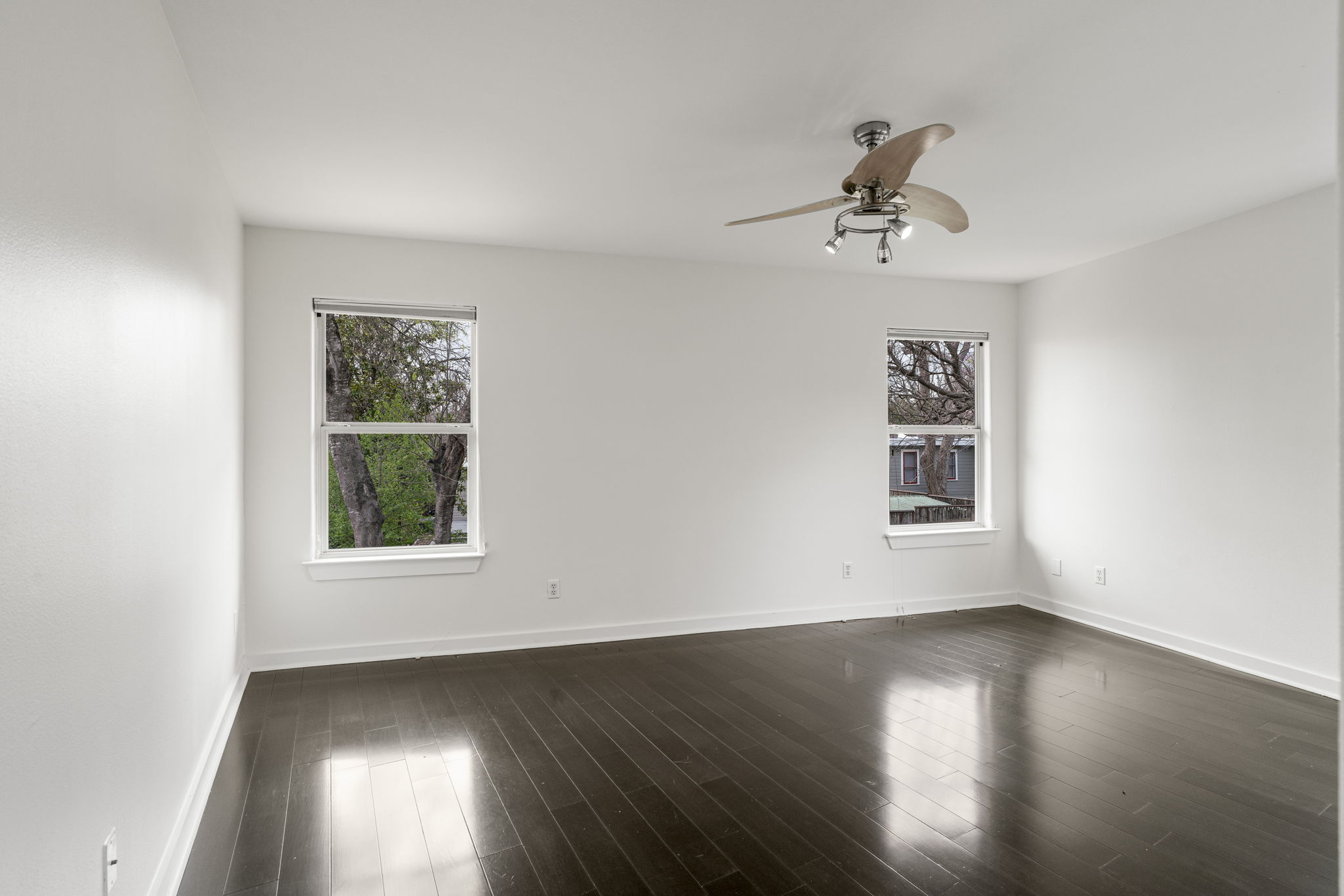 2114 Goodrich Avenue, Unit 10 Austin, TX 78704 - Photo 22 of 35 A bright secondary bedroom provides flexibility for guests, a home office, or creative space.