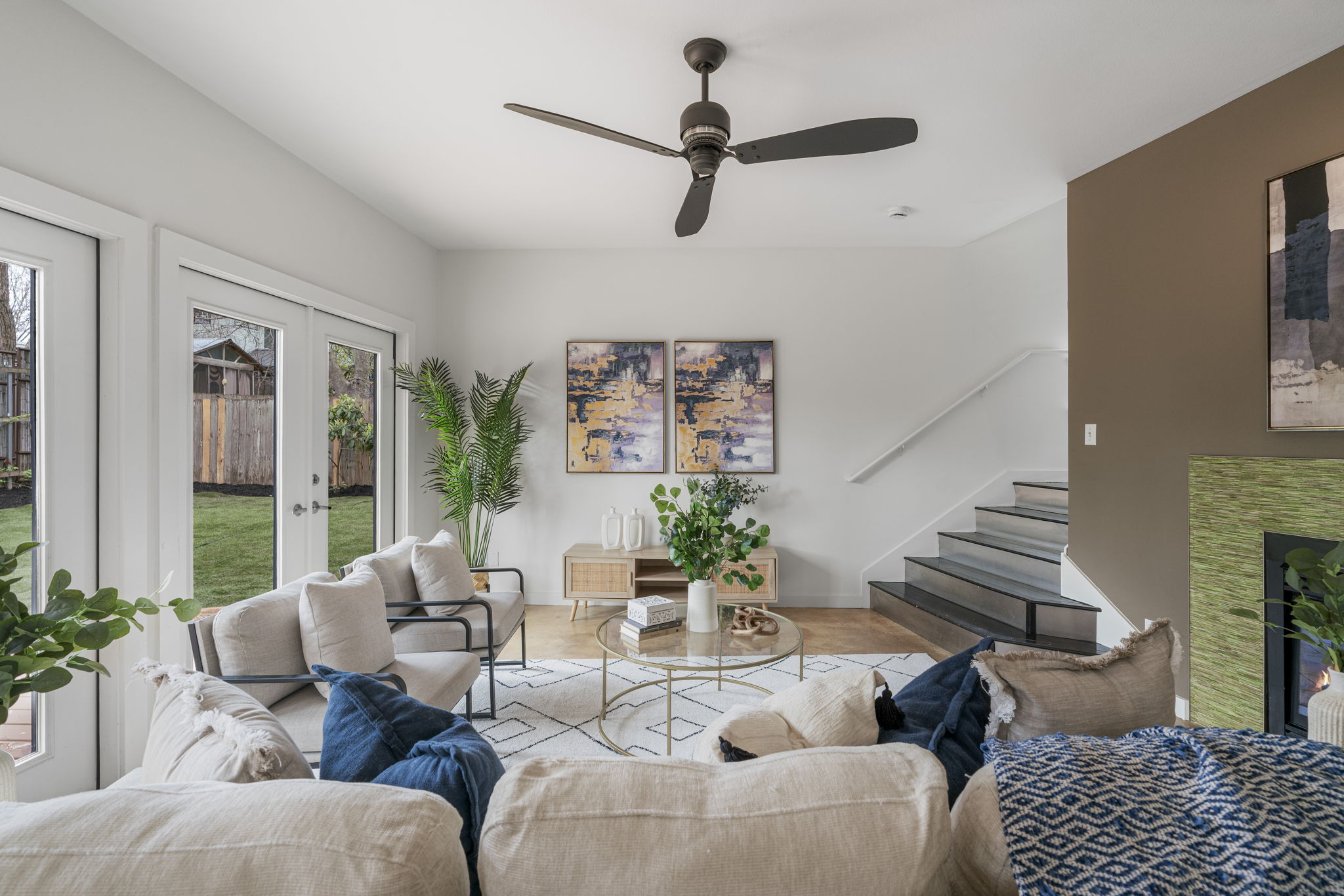 2114 Goodrich Avenue, Unit 10 Austin, TX 78704 - Photo 5 of 35 A cozy gas fireplace anchors the living room, creating the perfect setting for relaxed evenings at home after dinner on South Lamar.