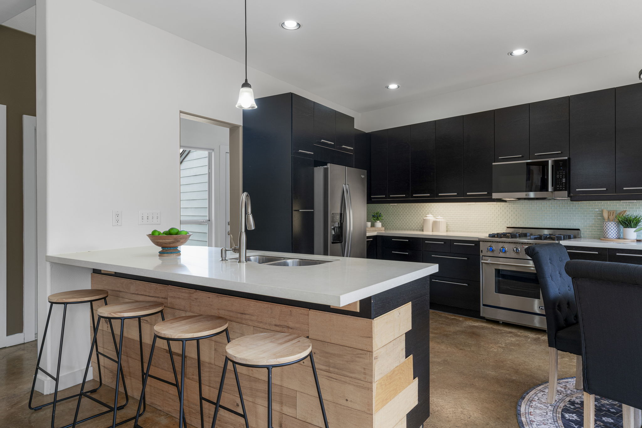 2114 Goodrich Avenue, Unit 10 Austin, TX 78704 - Photo 6 of 35 The breakfast bar offers a comfortable spot for morning coffee before heading out to nearby trails, cafés, and neighborhood favorites.