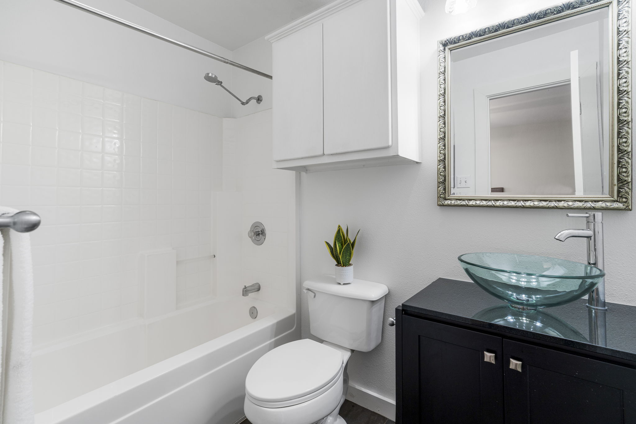 2114 Goodrich Avenue, Unit 10 Austin, TX 78704 - Photo 9 of 35 The primary bathroom features a comfortable, functional layout designed to make it easy to start and end each day.