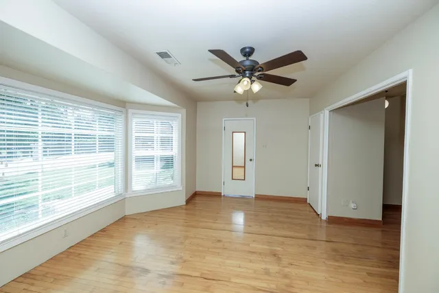 a view of cabinets with wooden floor