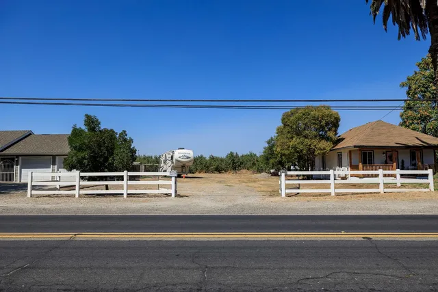 a bathroom with a toilet and a shower curtain