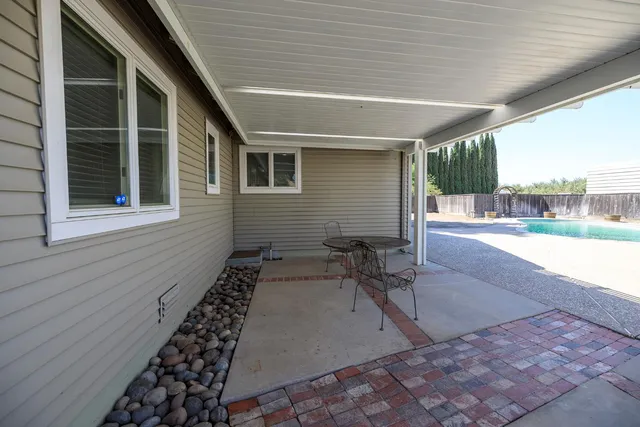 a view of house with yard and green space