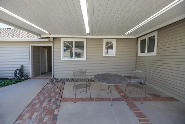 an aerial view of residential building with outdoor space and lake view