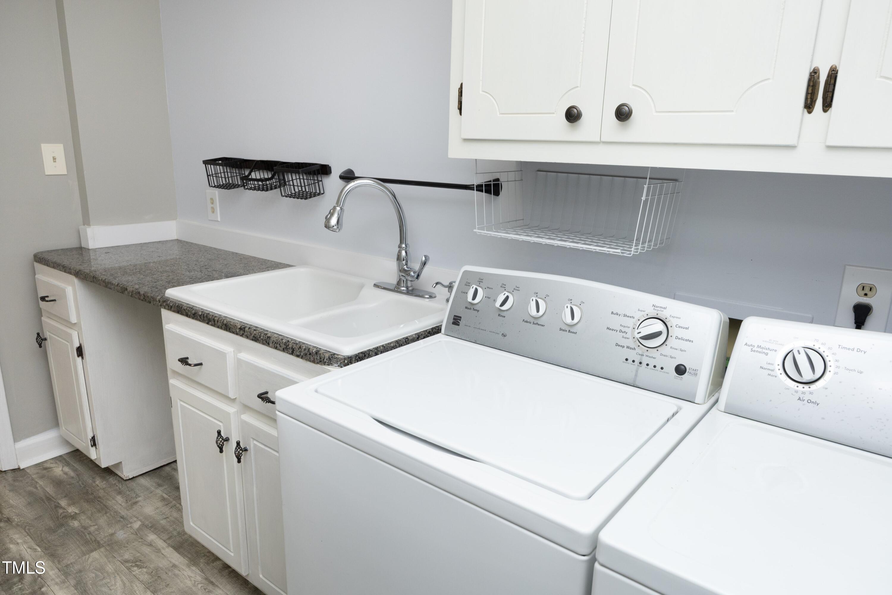 409 Glaive Drive Durham, NC 27703 - Photo 18 of 35 a utility room with dryer and washer