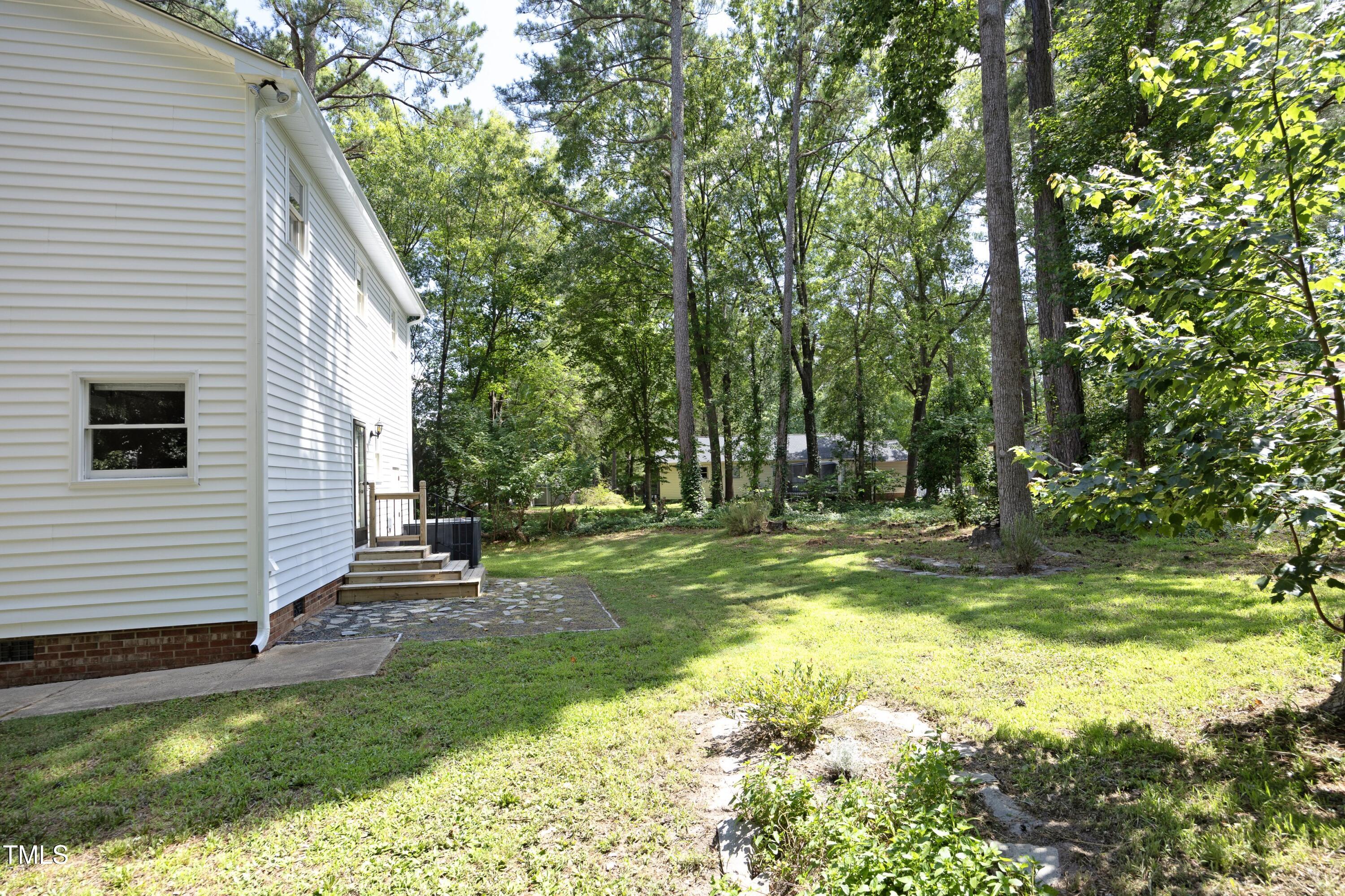409 Glaive Drive Durham, NC 27703 - Photo 32 of 35 a view of a house with a yard