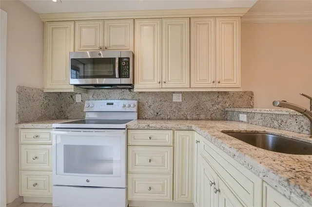a en suite bathroom with a sink and a shower