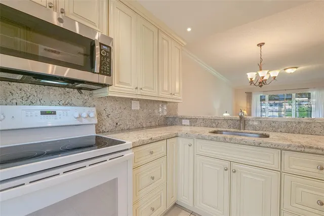 a bedroom with a bed a couch and a window