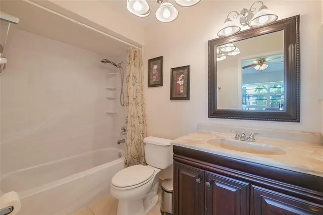 a view of a hallway with furniture and wooden floor