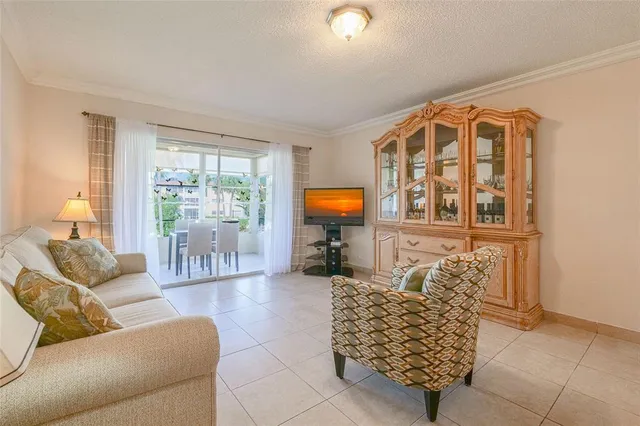 a dining room with furniture and chandelier