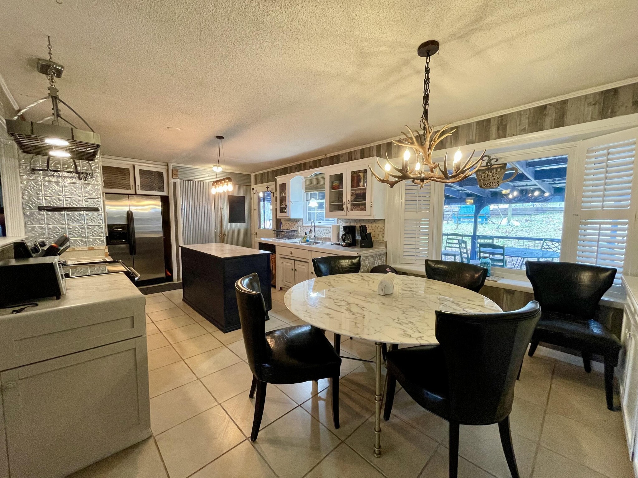1522 Turkey Creek Road Tellico Plains, TN 37385 - Photo 8 of 34 a large kitchen with a table and chairs