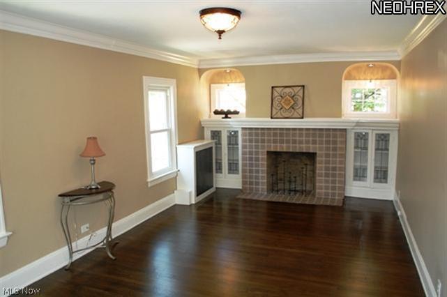 3125 Yorkshire Road Cleveland, OH 44118 - Photo 8 of 22 Spacious living room with refinished hardwood floors, gas fireplace and leaded glass built-ins