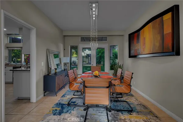 a front view of a house with outdoor seating