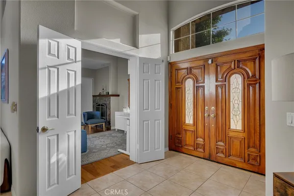 a view of an entryway and hall with wooden floor