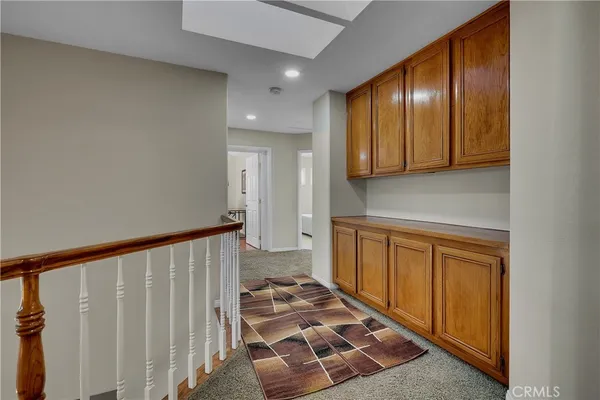 a spacious bathroom with a sink and a mirror