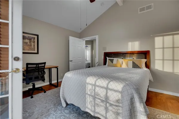 a en suite bathroom with a granite countertop sink a mirror a bathtub and shower