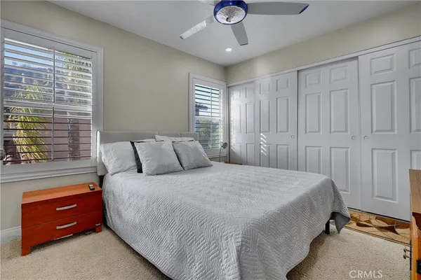 a bathroom with a granite countertop tub sink and shower