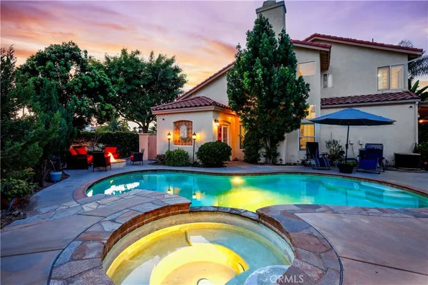 a swimming pool with outdoor seating yard and outdoor seating