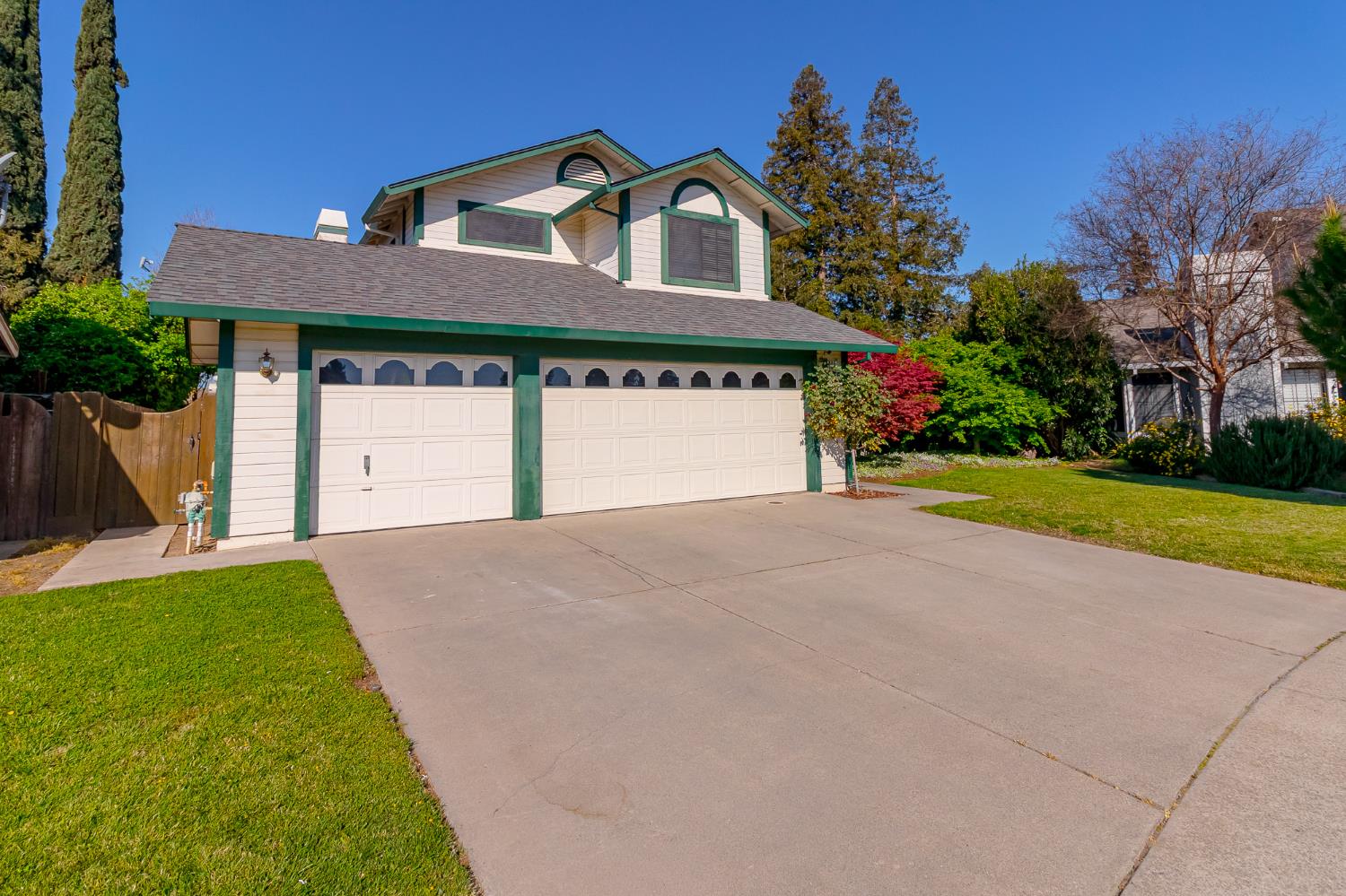 4209 Godfrey Drive Salida, CA 95368 - Photo 1 of 34 a front view of a house with a yard and garage