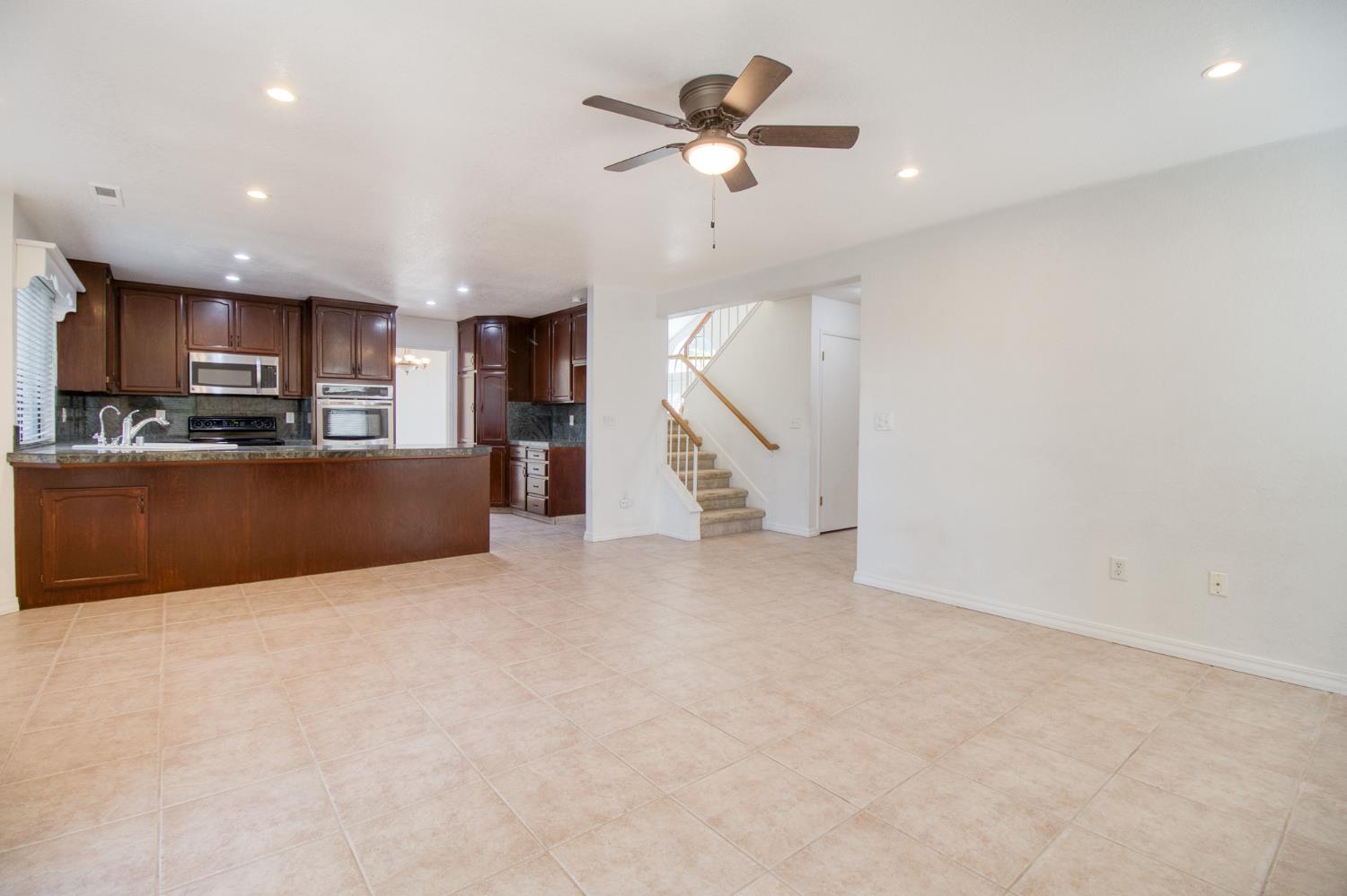 4209 Godfrey Drive Salida, CA 95368 - Photo 17 of 34 a view of a kitchen with a sink and a ceiling fan
