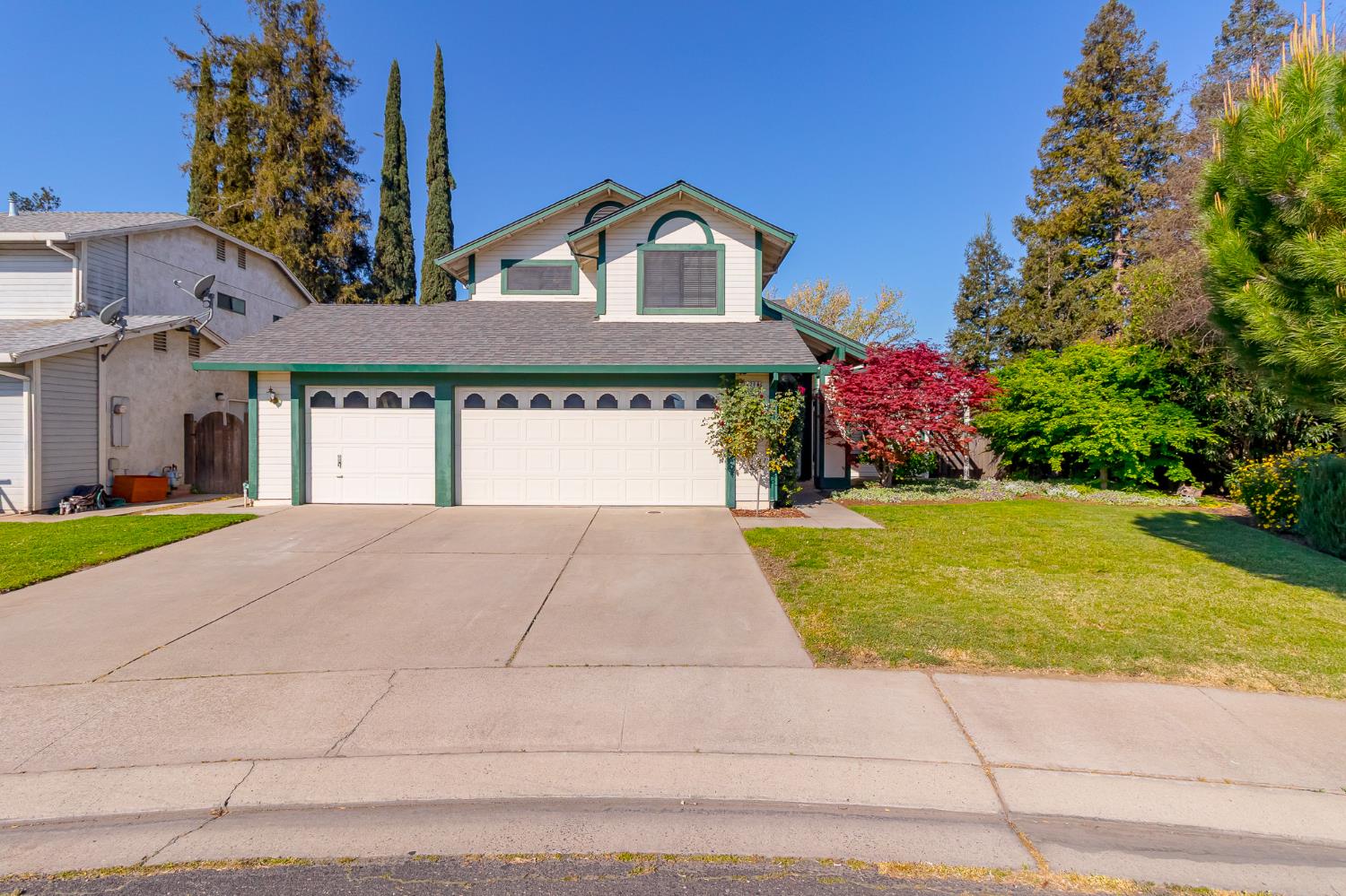 4209 Godfrey Drive Salida, CA 95368 - Photo 2 of 34 a front view of a house with a yard and garage