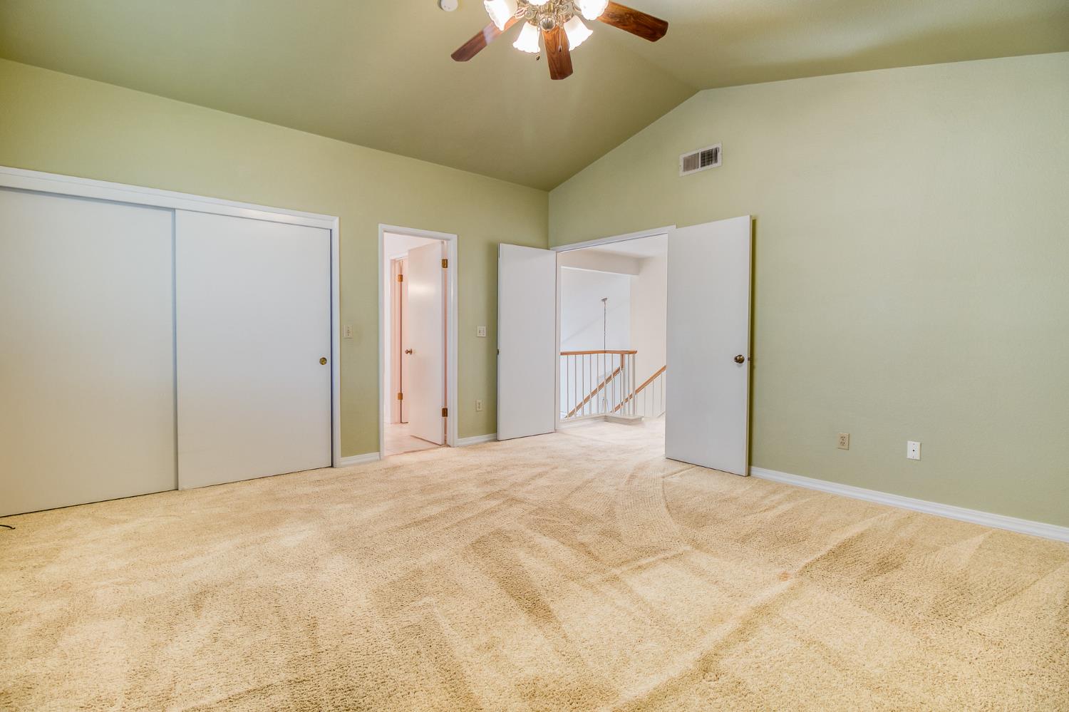4209 Godfrey Drive Salida, CA 95368 - Photo 23 of 34 a view of a livingroom with a chandelier fan and closet area