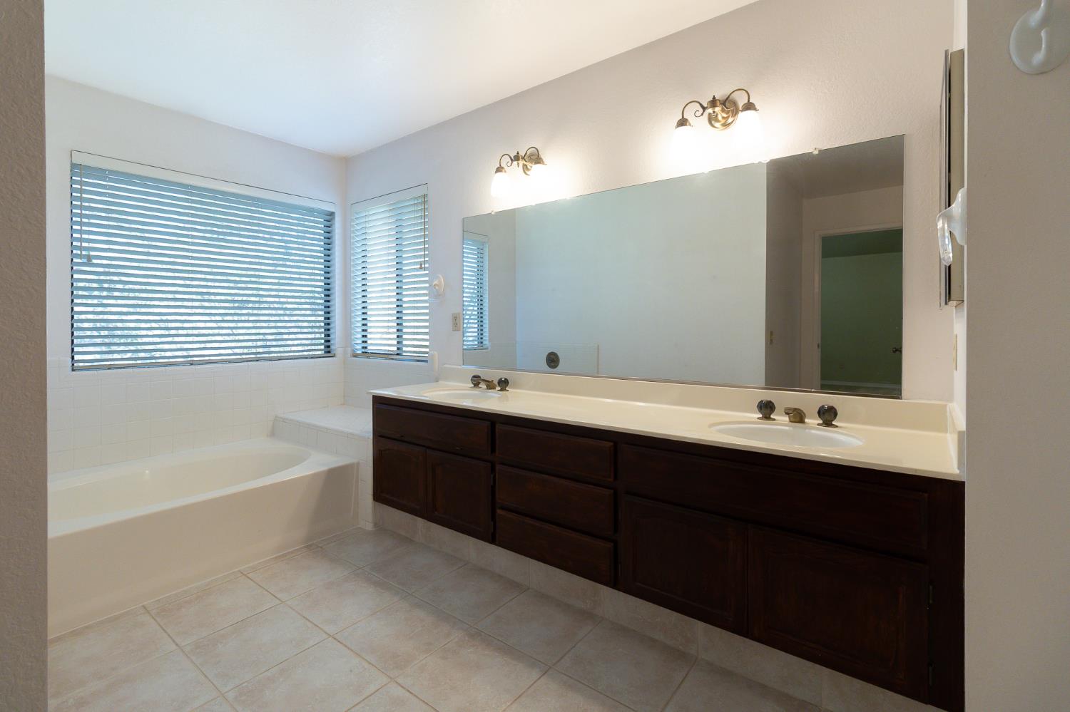 4209 Godfrey Drive Salida, CA 95368 - Photo 24 of 34 a bathroom with a tub sink and mirror