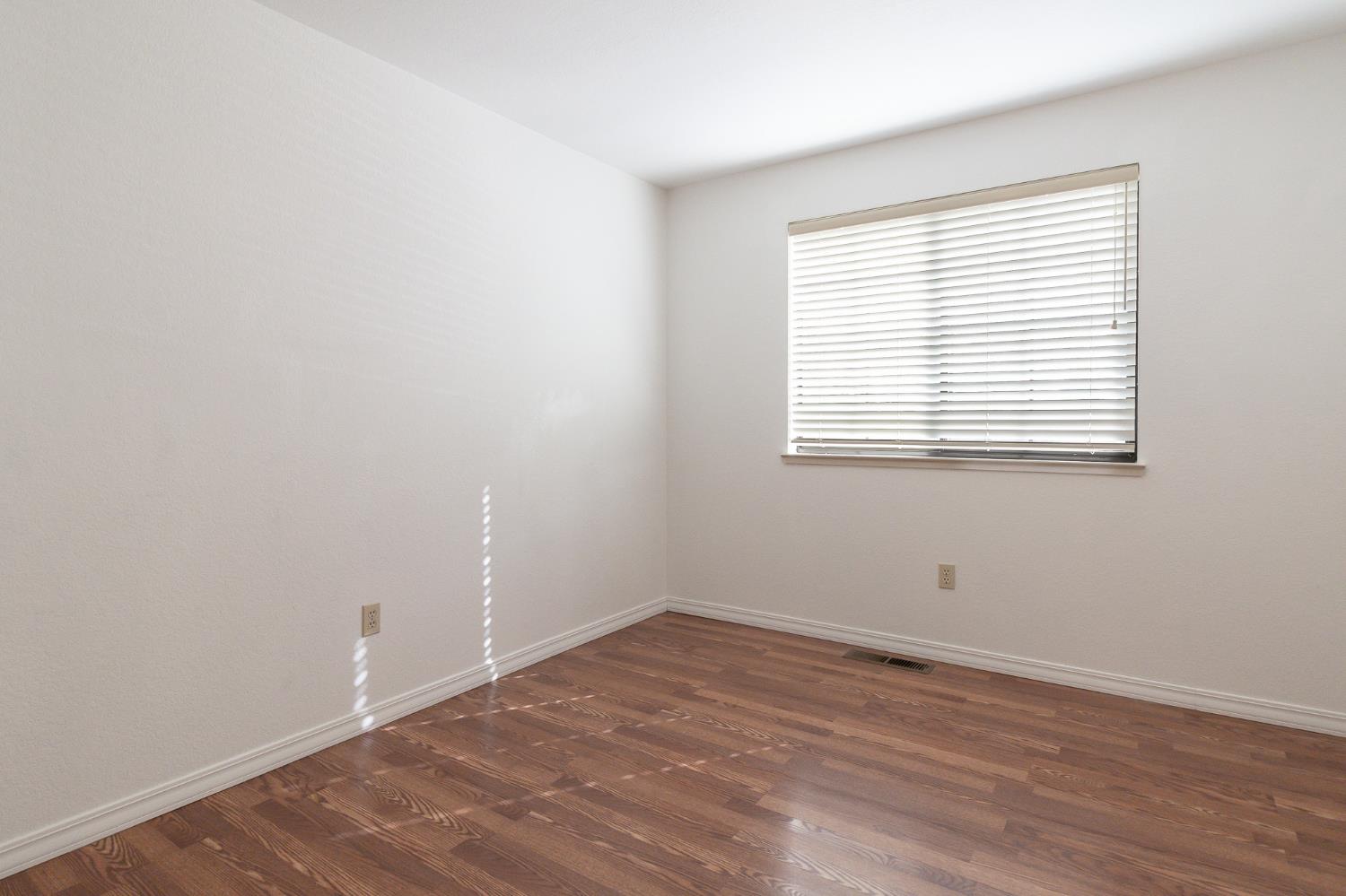 4209 Godfrey Drive Salida, CA 95368 - Photo 30 of 34 wooden floor in an empty room with a window
