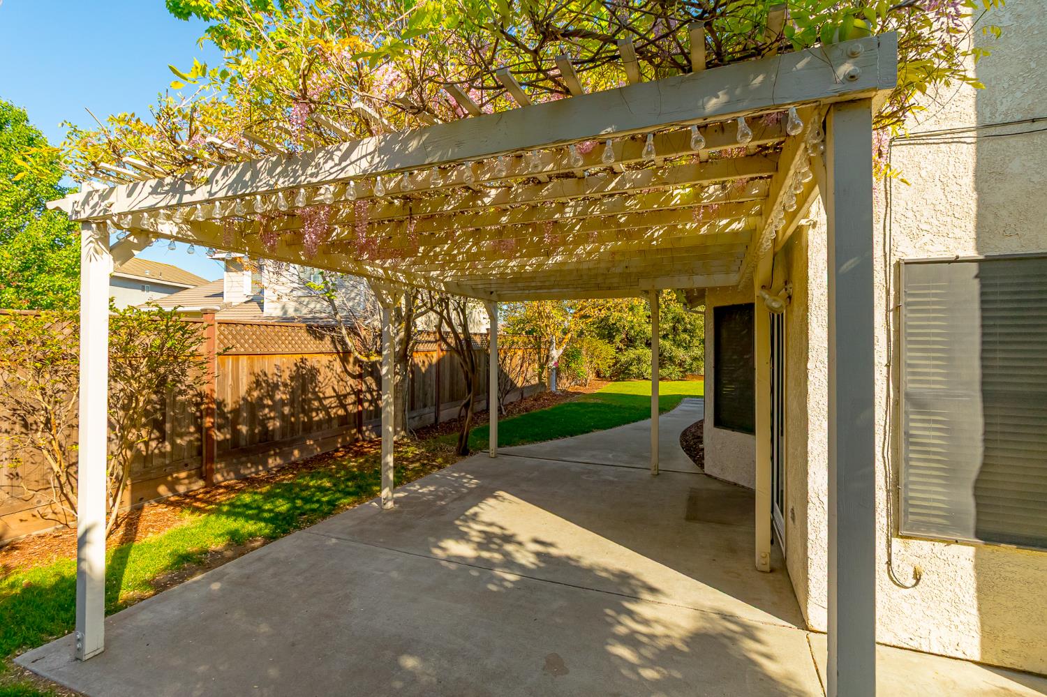 4209 Godfrey Drive Salida, CA 95368 - Photo 32 of 34 a view of a porch with a table and chairs next to a yard
