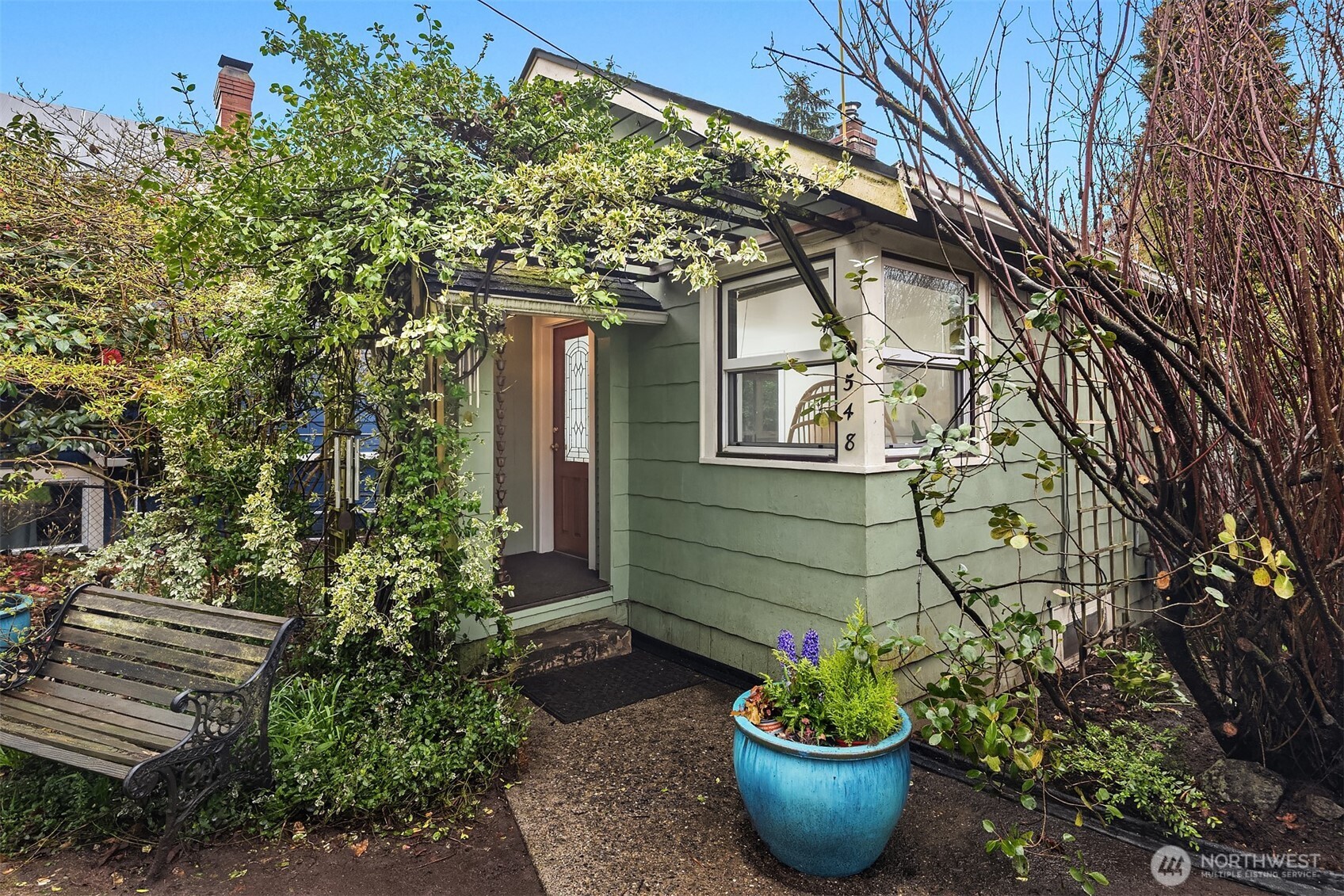 a view of a house with a potted plant