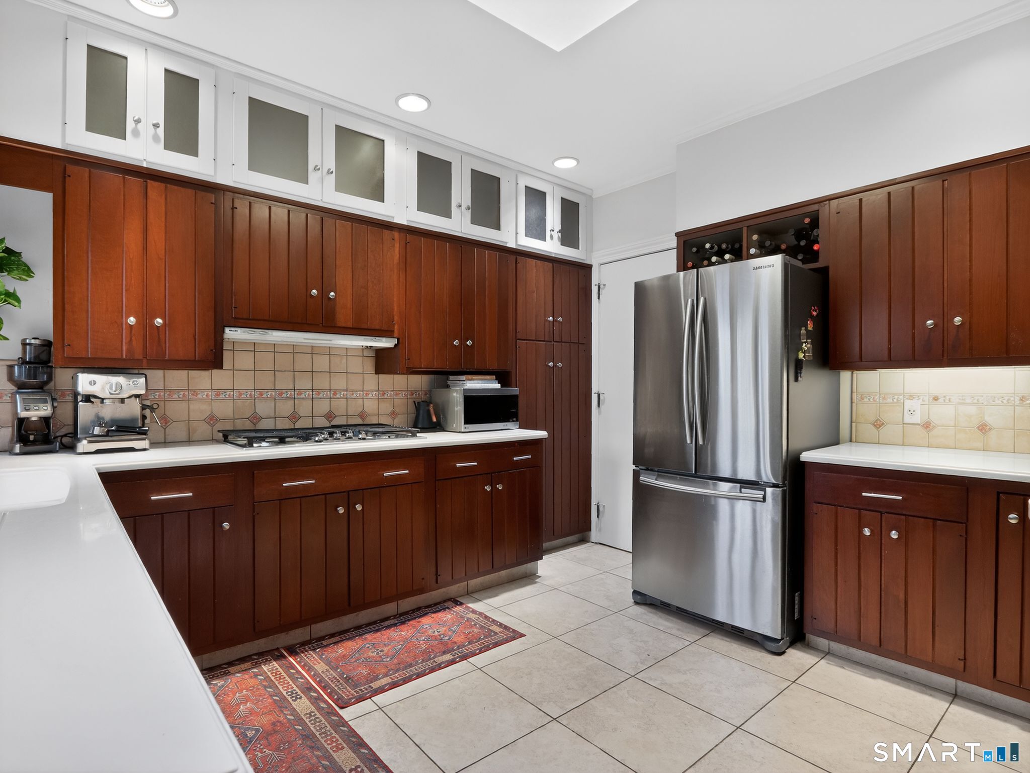 59 Broadfield Road Hamden, CT 06517 - Photo 12 of 40 a kitchen with granite countertop wooden cabinets and stainless steel appliances
