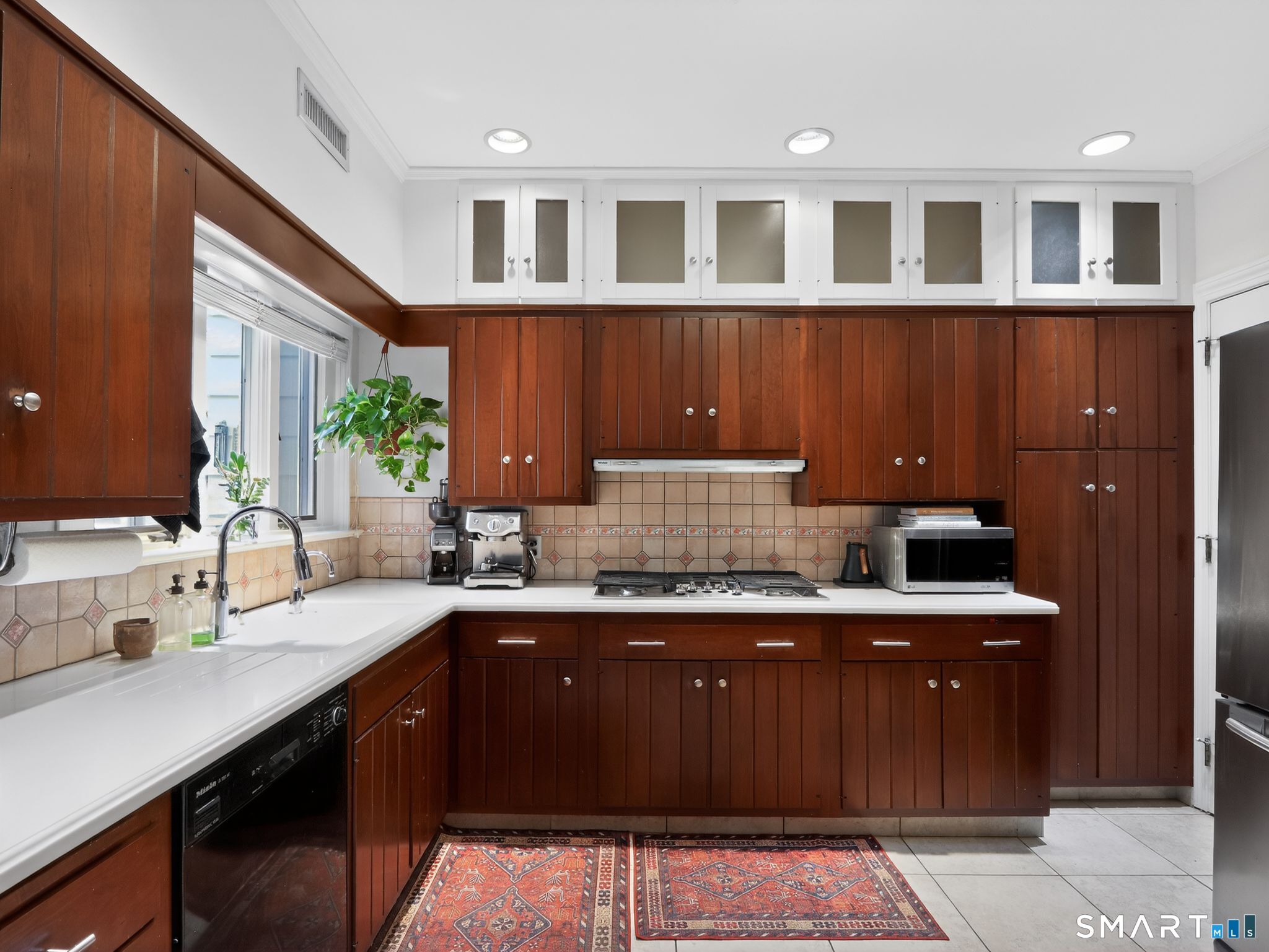 59 Broadfield Road Hamden, CT 06517 - Photo 13 of 40 a kitchen with a sink and cabinets