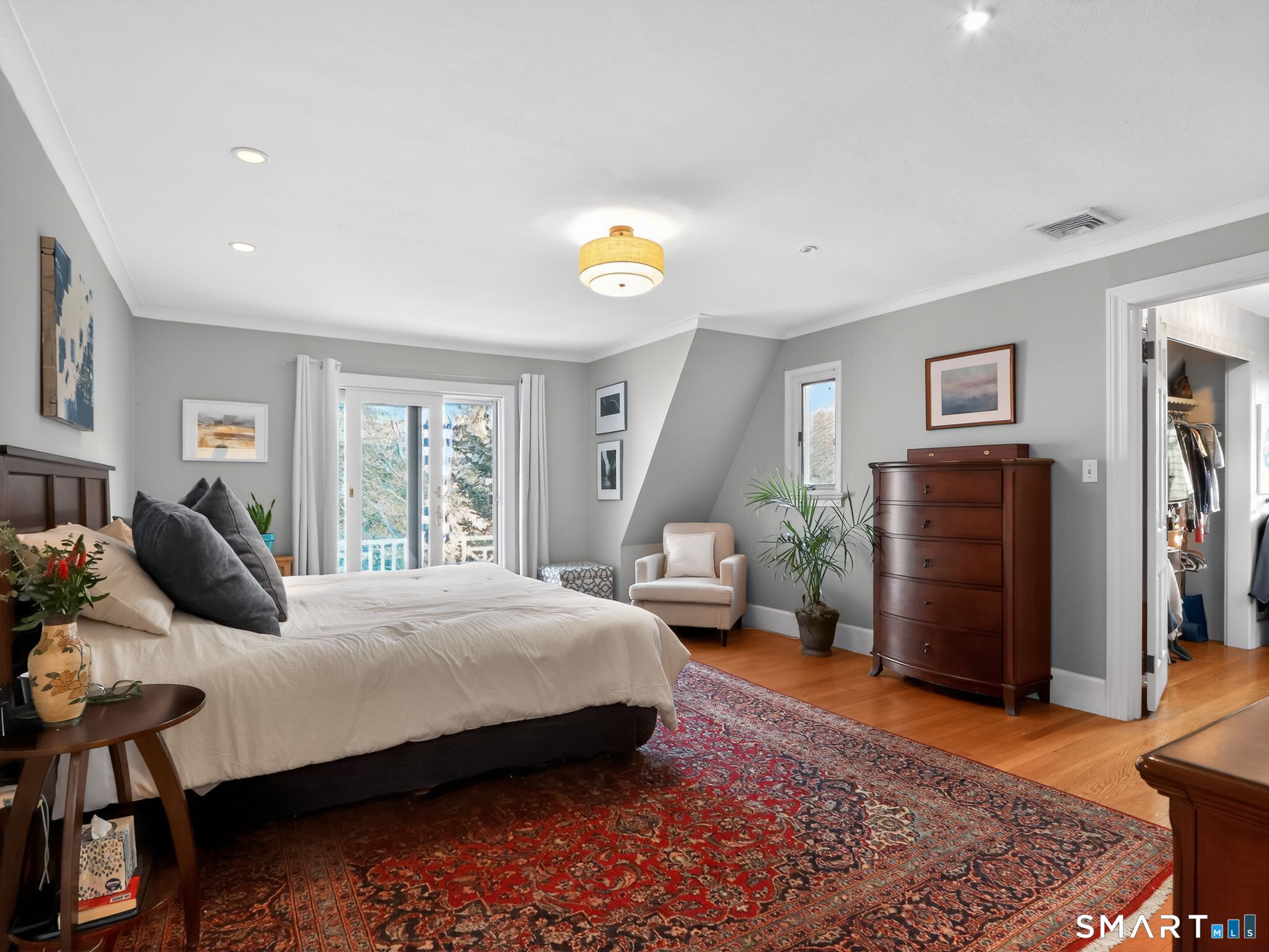 59 Broadfield Road Hamden, CT 06517 - Photo 16 of 40 a bedroom with a bed and wooden floor