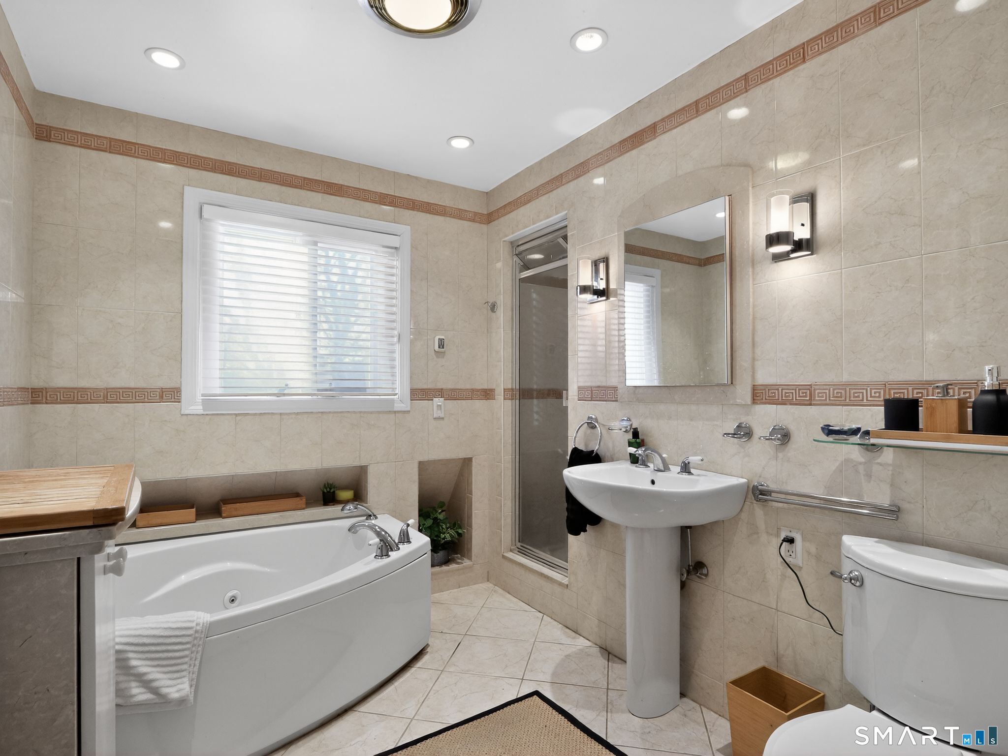 59 Broadfield Road Hamden, CT 06517 - Photo 19 of 40 a bathroom with a sink mirror toilet bathtub and vanity