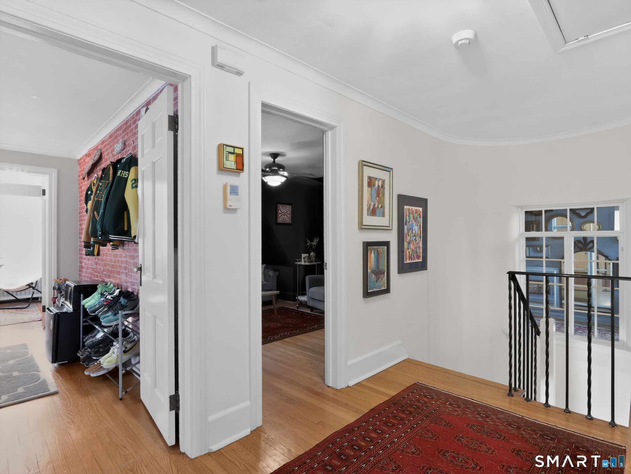 59 Broadfield Road Hamden, CT 06517 - Photo 21 of 40 a view of livingroom with hardwood floor and a ceiling fan