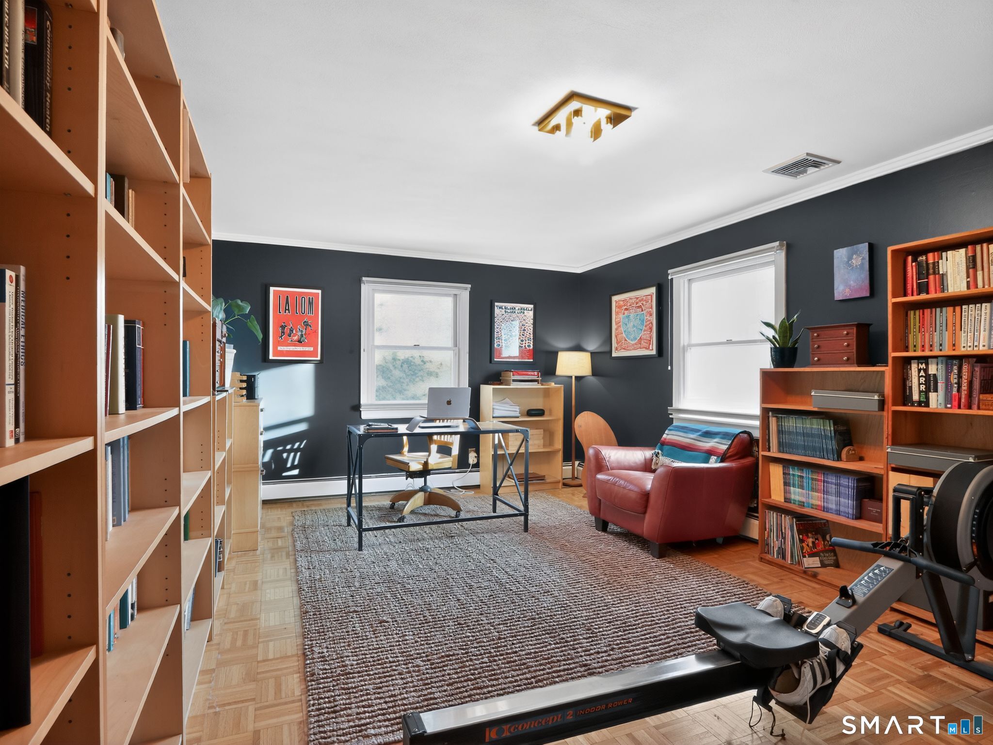 59 Broadfield Road Hamden, CT 06517 - Photo 23 of 40 a living room with furniture and a book shelf