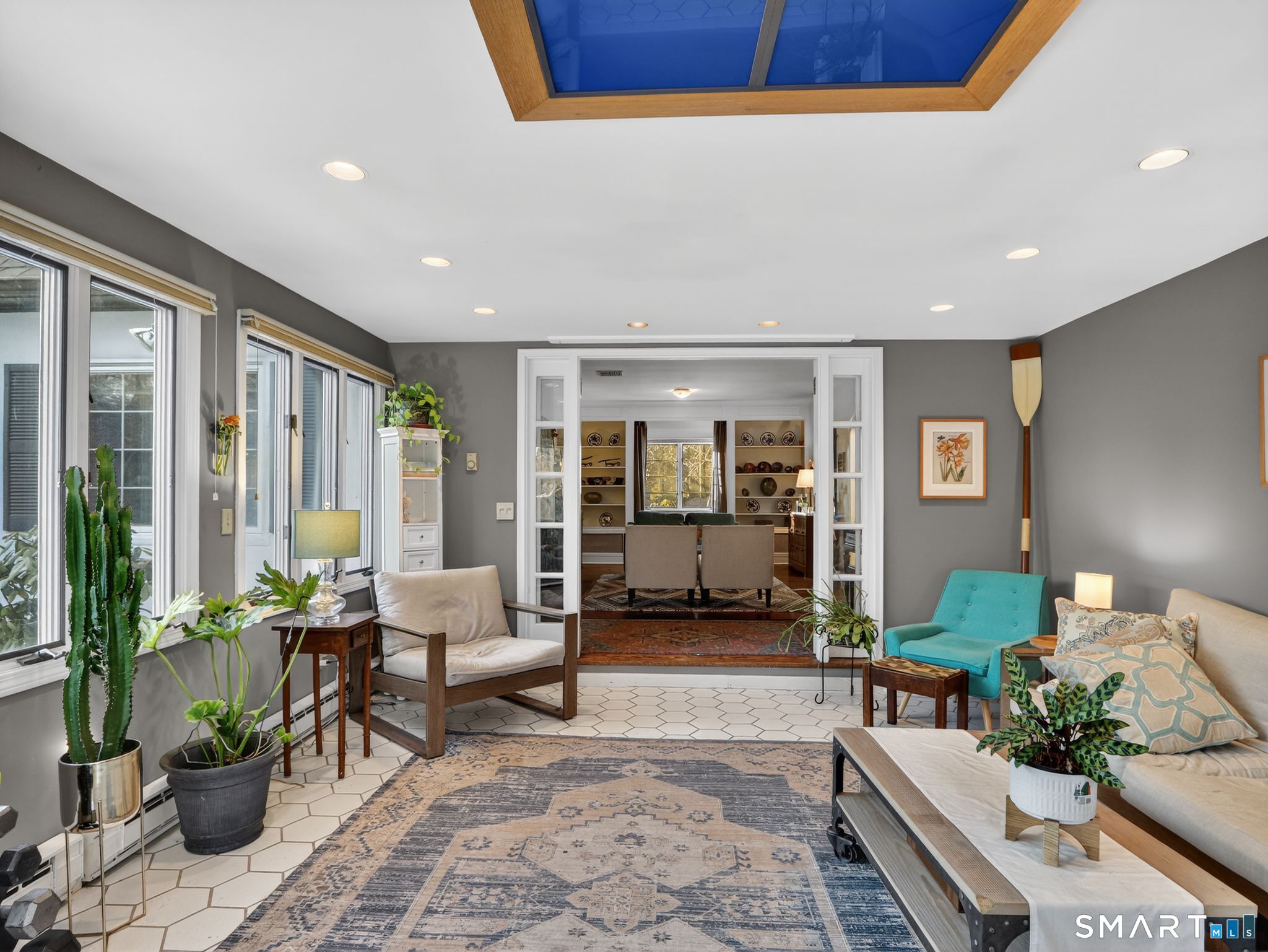 59 Broadfield Road Hamden, CT 06517 - Photo 9 of 40 a living room with furniture and a potted plant