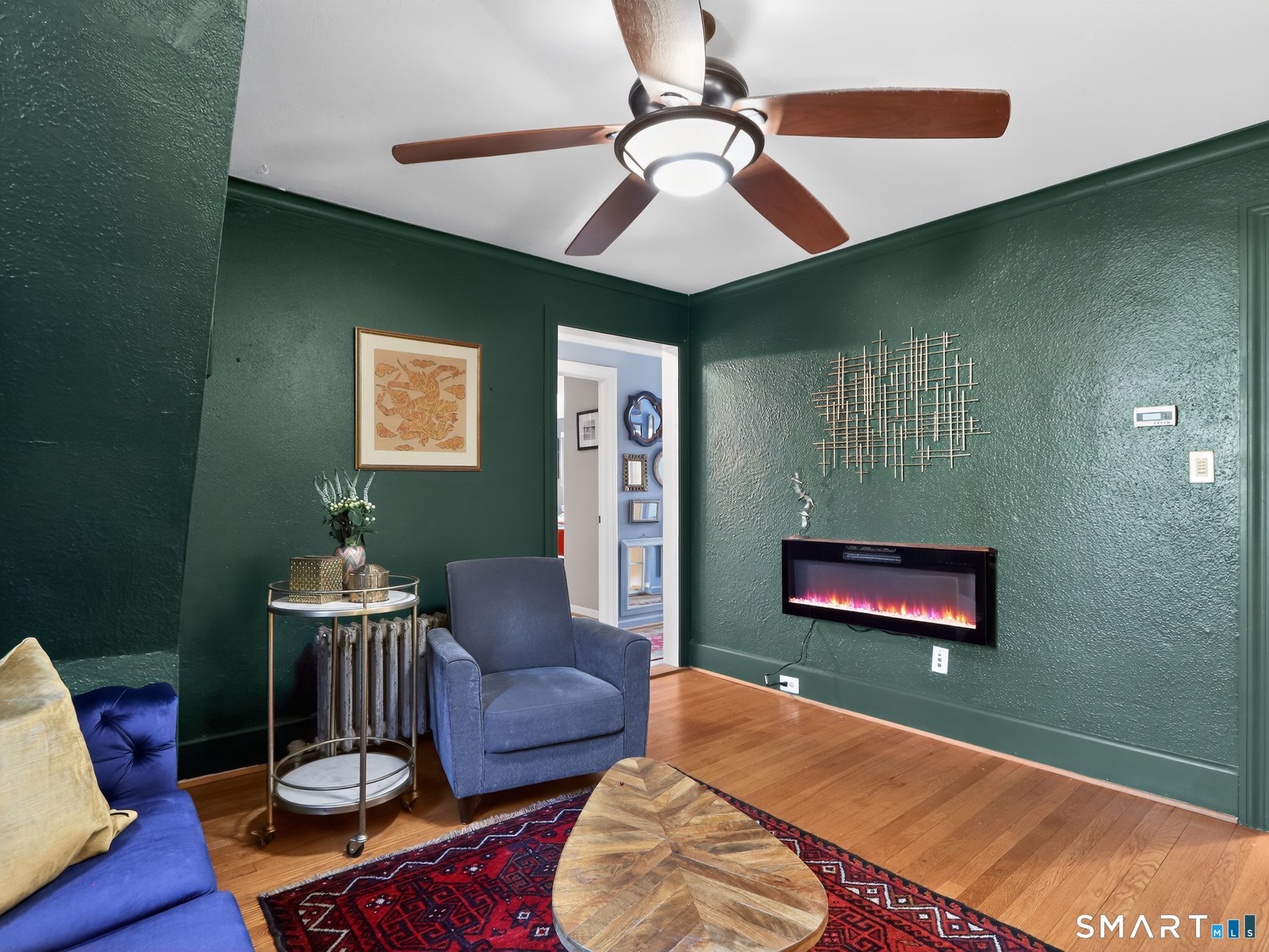 59 Broadfield Road Hamden, CT 06517 - Photo 10 of 40 a living room with furniture and a wooden floor