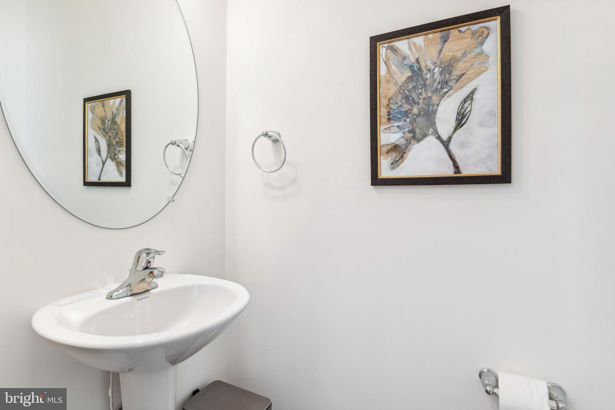 1508 Falcon Lane, Unit 252 Chambersburg, PA 17202 - Photo 11 of 12 a bathroom with a sink and a mirror