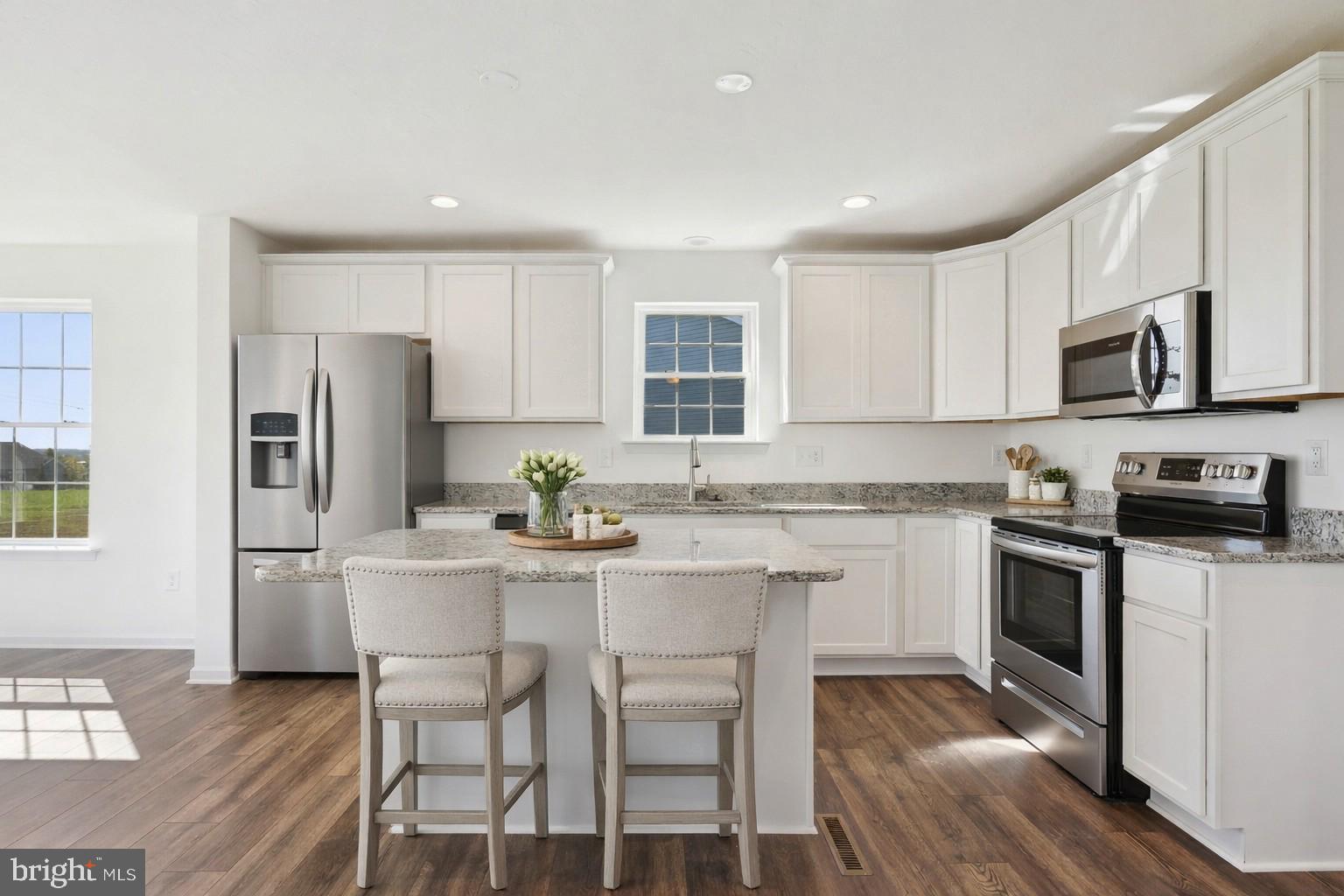 1508 Falcon Lane, Unit 252 Chambersburg, PA 17202 - Photo 4 of 12 a kitchen with white cabinets and stainless steel appliances