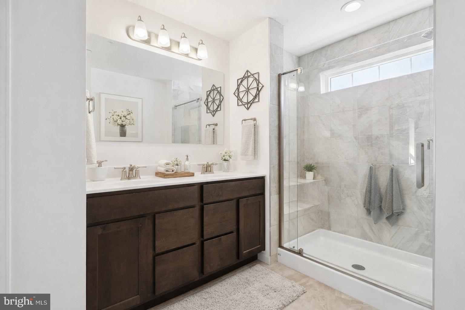 1508 Falcon Lane, Unit 252 Chambersburg, PA 17202 - Photo 10 of 12 a bathroom with a sink double vanity and a mirror