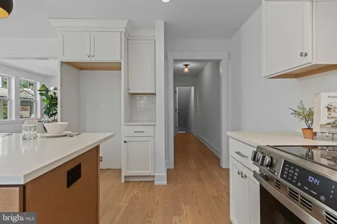 a bathroom with a shower sink and mirror