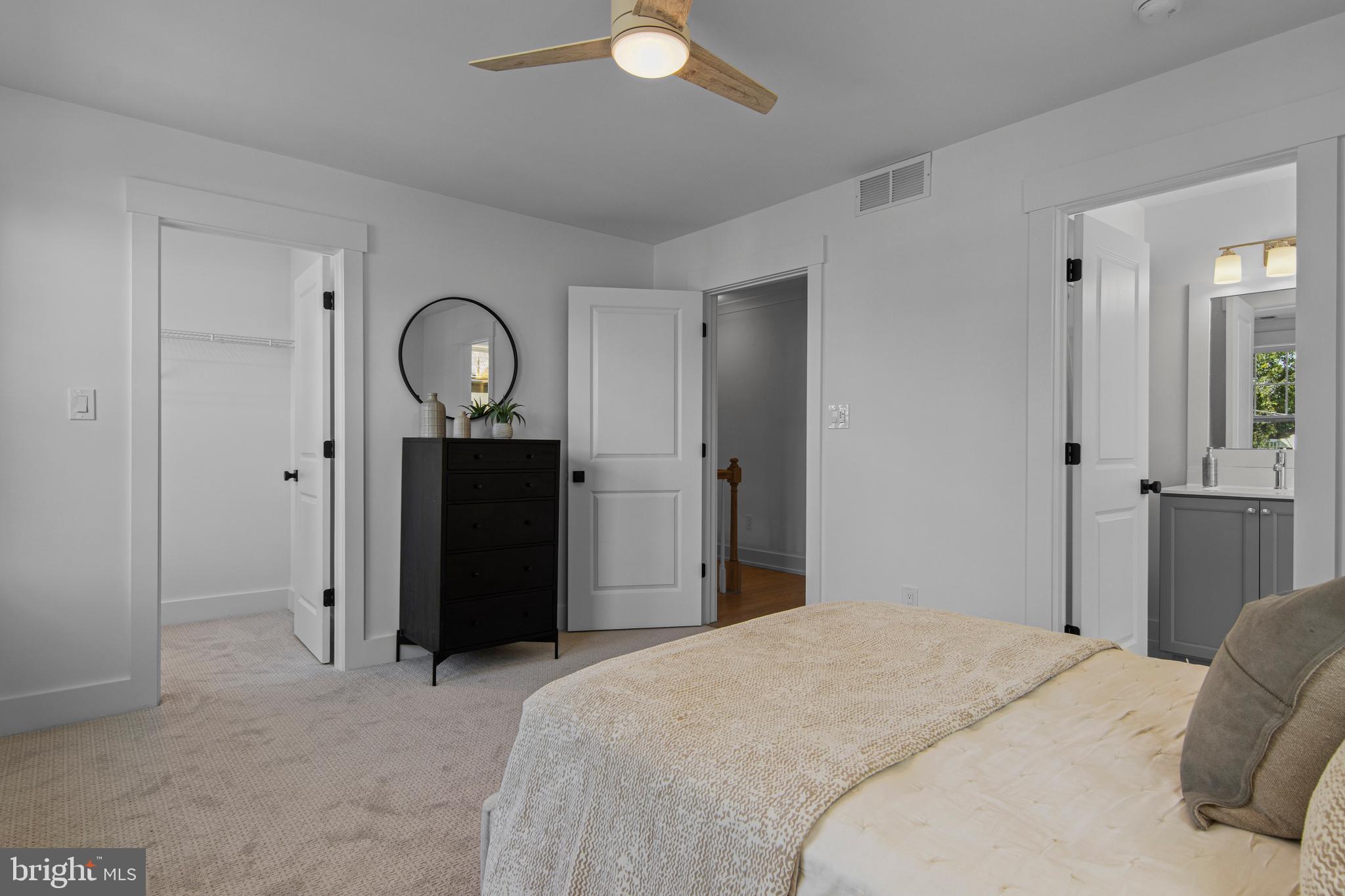 142 Merion Avenue Narberth, PA 19072 - Photo 39 of 67 a bedroom with a bed and a chandelier