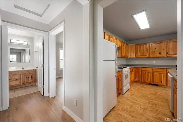 a view of kitchen with cabinets and wooden floor