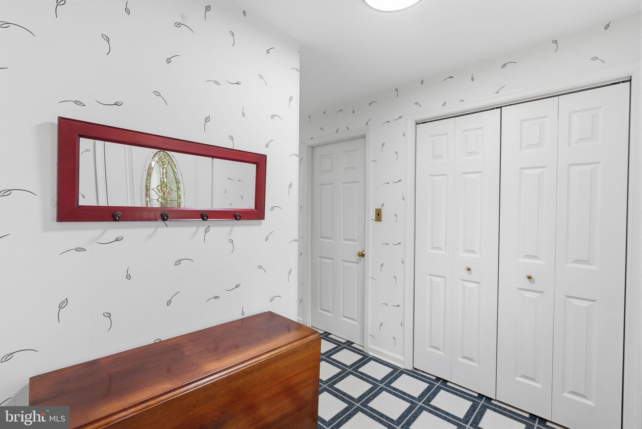 81 Cherokee Road Doylestown, PA 18901 - Photo 14 of 43 a room with a bed and a mirror