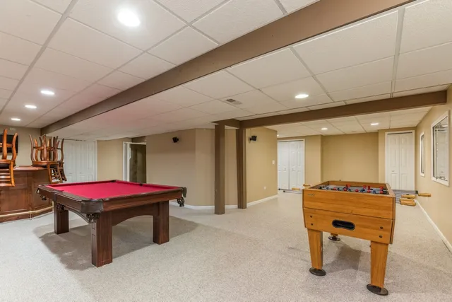 a room with furniture pool table table tennis table