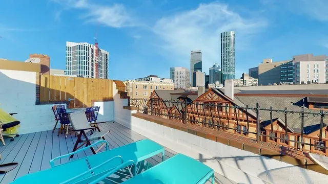 a view of a balcony with yard