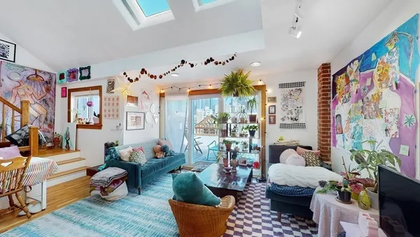 a kitchen with stainless steel appliances granite countertop sink refrigerator and microwave