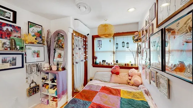 a bedroom with a bed and furniture