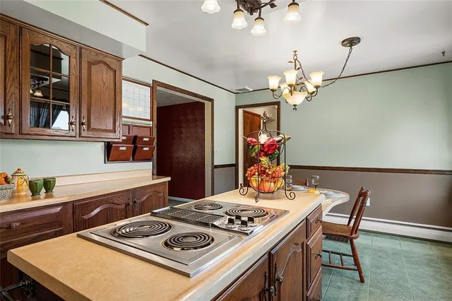 a kitchen with a table and chairs in it